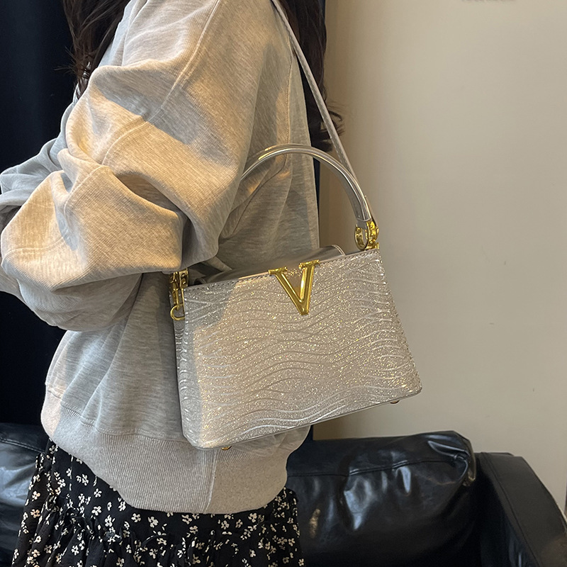 Bolsa de alta calidad de textura 2025 verano nuevo estilo bolso de hombro con patrón de ondas bolso de mensajero con patrón de serpiente de lentejuelas mujer