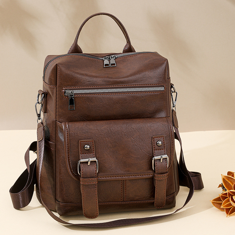 Inventario al por mayor transfronterizo nuevo estilo coreano retro mochila de mujer moda mochila de viaje multifuncional de cuero suave