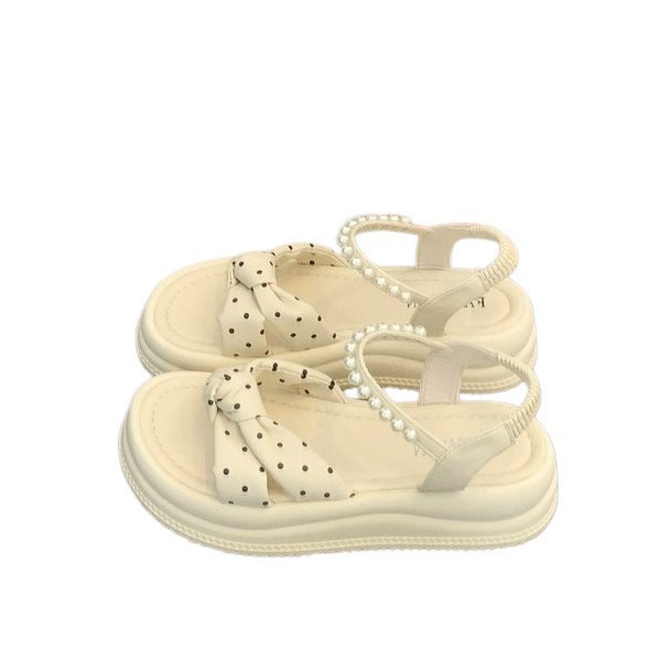 Punto de ondas de alto nivel de sensación de sandálias de suela gruesa para mujeres 2026 nuevo verano suave estilo francés de hadas zapatos de perlas romanas