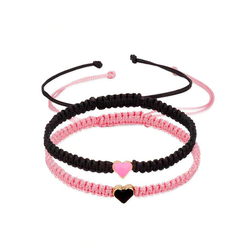 Joyería transfronteriza europea y americana en forma de corazón pulsera tejida a mano pulsera de pareja de amor de las mujeres pulsera de corazón de melocotón blanco y negro al por mayor