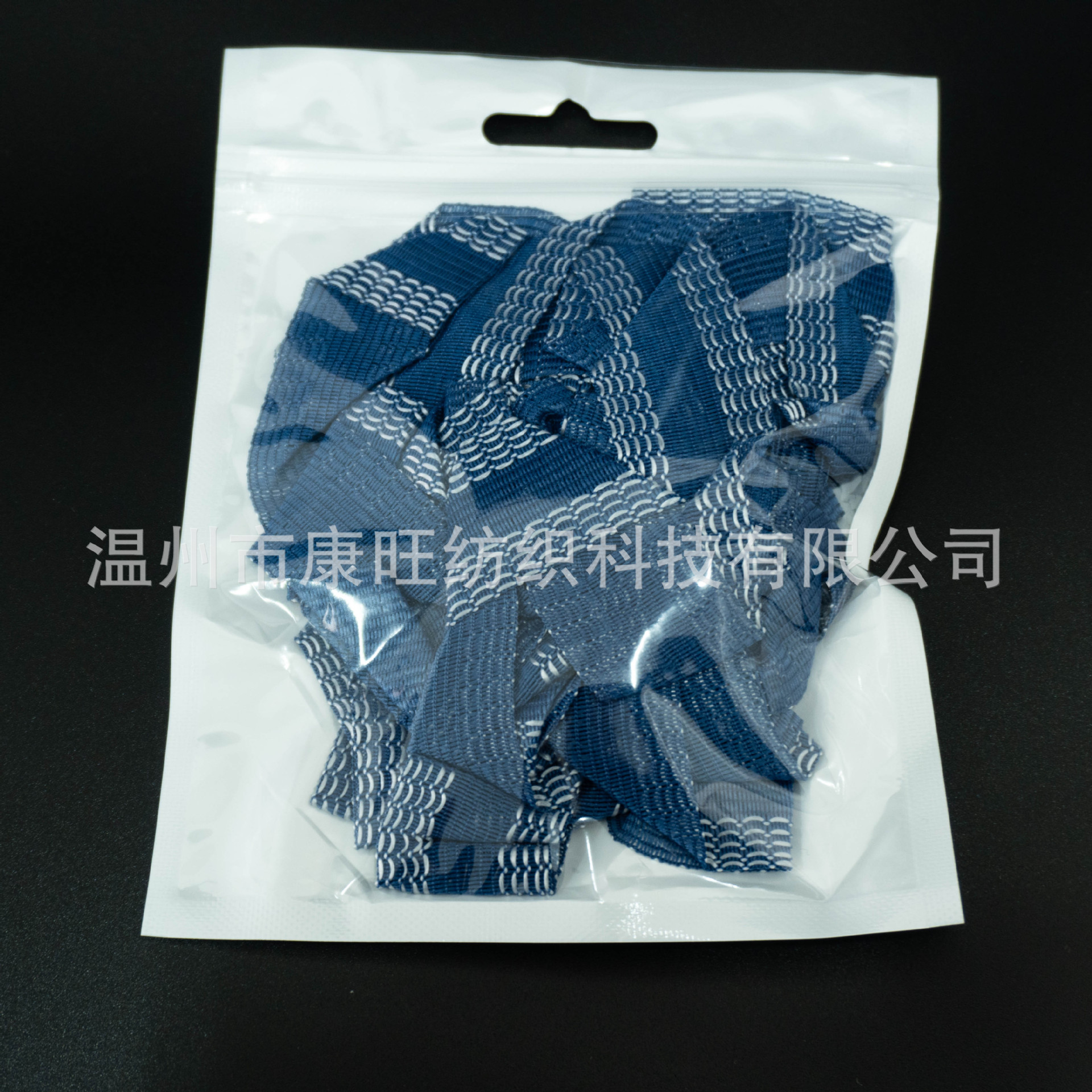 Los pantalones de la fábrica de Wenzhou se pegan en la boca del pantalón se acortan