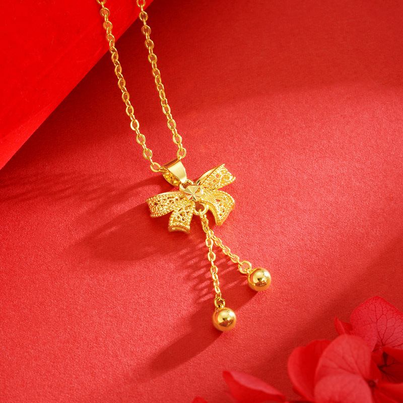 Princesa arco colgante dulce moda todo-fósforo de las mujeres en línea rojo caliente borla DIY arena oro collar Accesorios