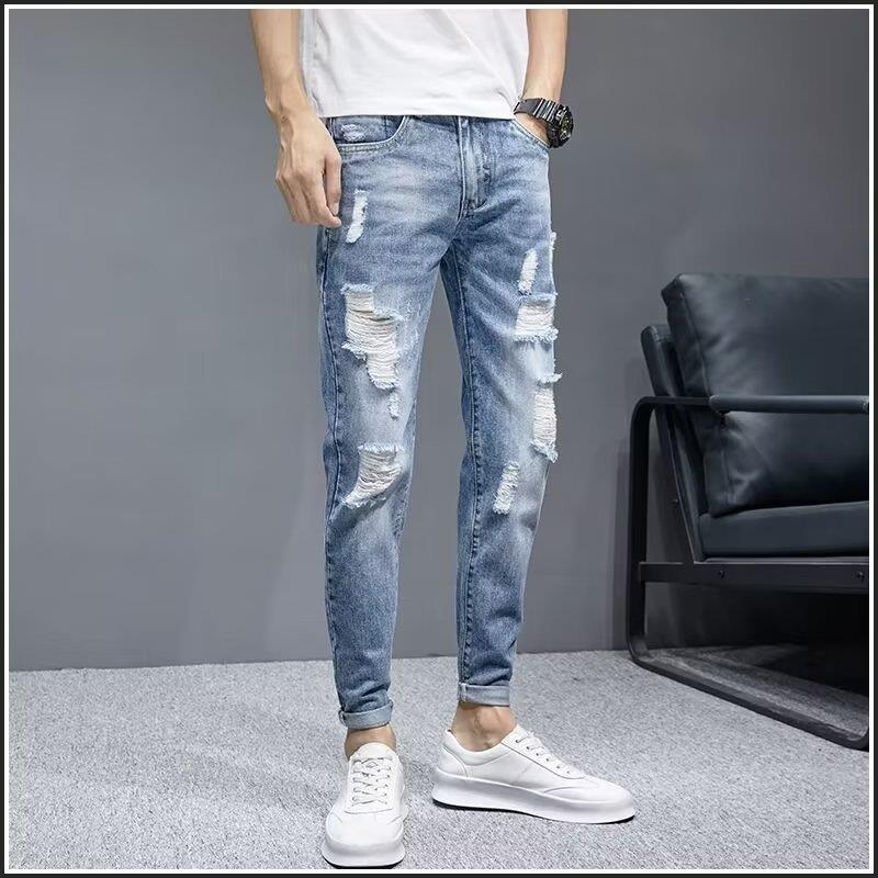 Factory direct sales of lightweight light-colored ripped jeans for men, trendy brand, slim fit, versatile, cropped, and flattering casual pants.