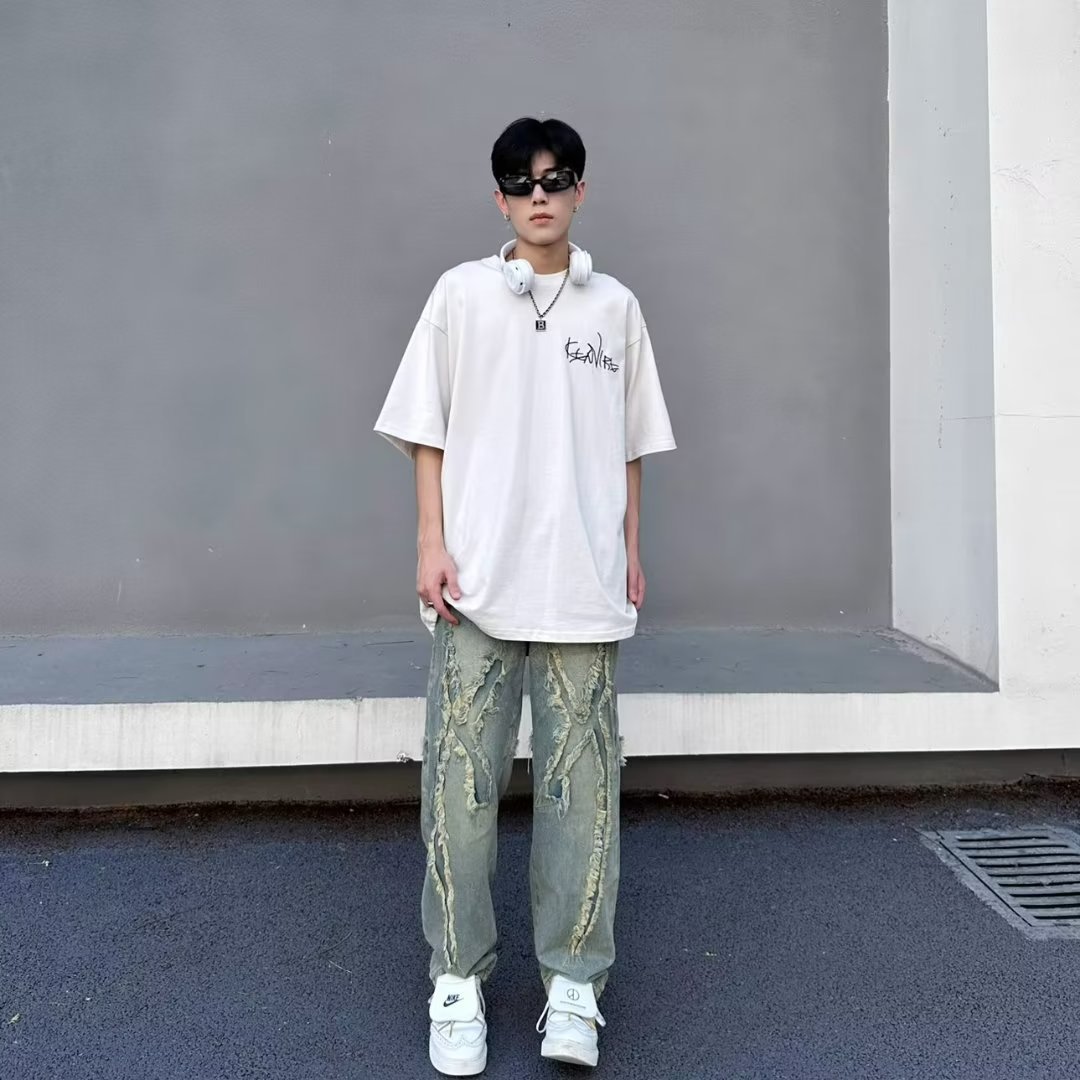 American High Street vintage jeans hombres Vibe desgastado parche diseño de pierna ancha pantalones casuales Pantalones rectos sueltos moda