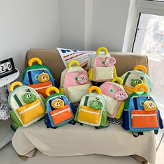 幼稚園の軽やかな帯の学生のかばんの潮流は色を合わせます子供のリュックサックの漫画のかわいい男女の子供のリュックサック