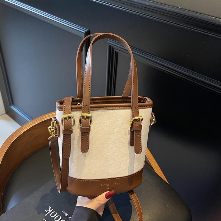 Bolso de mano de color de contraste de comercio exterior para mujer 2025 nuevo bolso de cubo de ocio salvaje simple bolso de mensajero de un solo hombro de alta gama