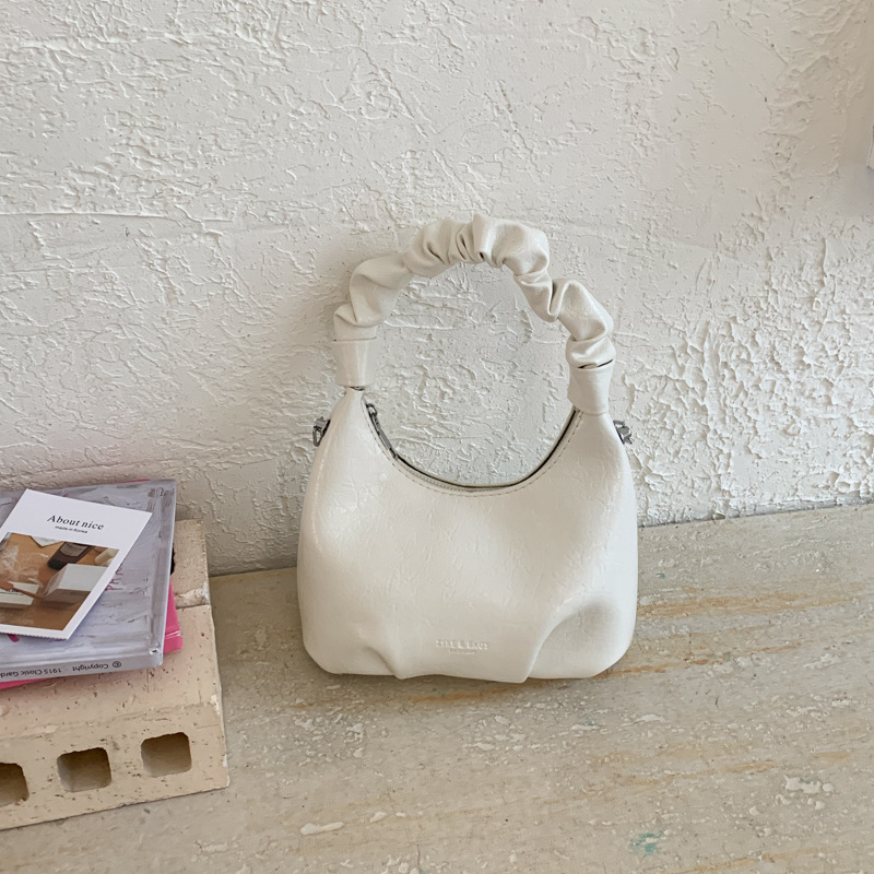 2026 primavera nueva moda temperamento bolso de hombro de moda bolso de arco de moda moda bolso de mano de tendencia diaria plegado mochila
