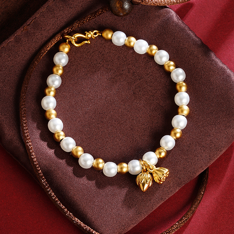 Pulsera de loto de oro de Gufa Sha imitación de perlas de aleación de cobre esferas ligeras de lujo Yiwu joyería suministro directo al por mayor