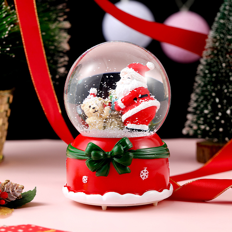 Una variedad de regalos de decoración de Navidad Navidad iluminante bola de cristal caja de música ventana diseño de velas lámparas de viento árbol de Navidad