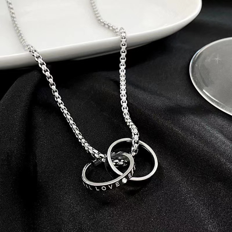 Collane in titanio da uomo di vendita calda, alla moda e personalizzate, doppi anelli ad incastro, olio gocciolante intarsiato_voghion.com