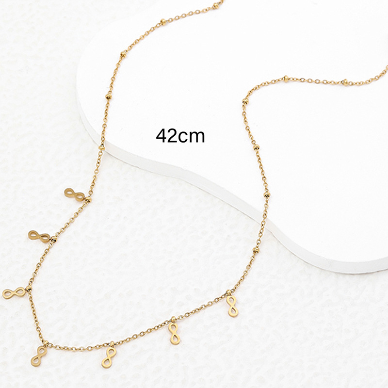 Collier exquis en acier titane doré avec croix fleurie_voghion.com
