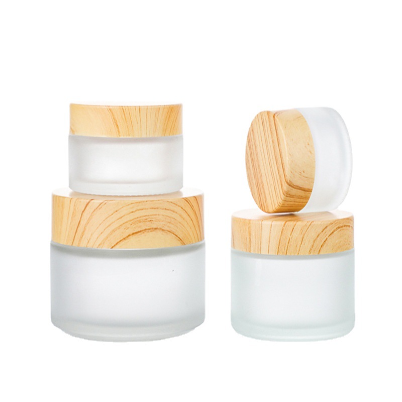 Venta al por mayor de madera grano cubierta botella de crema facial botella de crema botella cosmética de vidrio esmerilado 30g 50g crema sub-botella
