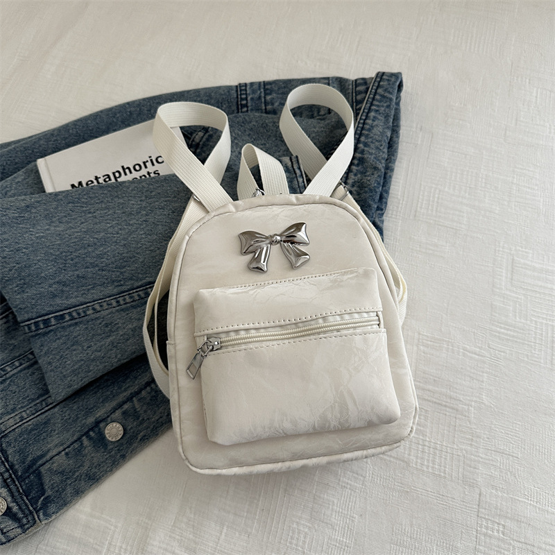 Mochila de arco para mujeres, estilo de estilo casual, moda coreana, mochila de balde, mochila de viaje pequeña y ligera