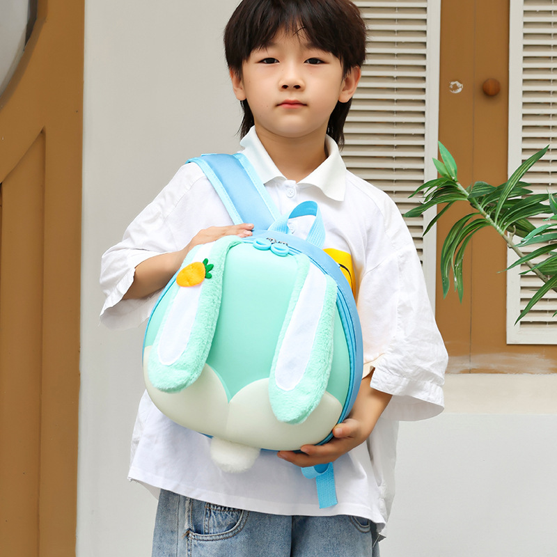 Jardín de infantes niños mochila de dibujos animados bonitas orejas grandes conejo bebé mochila portátil de cáscara de huevo mochila para niños
