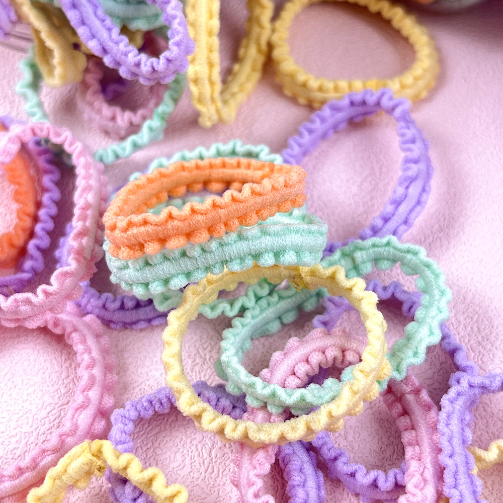 Banda de pelo para niños banda de goma al por mayor color caramelo lazo del pelo del bebé cuerda de pelo no duele la cuerda de pelo alta banda de goma elástica