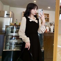 フランスのレトロな偽の2つの蝶結びは色のワンピースの女性の秋の服のデザイン感にぶつかります。