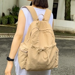 韓国版の大衆がデザインした新型シンプルなリュックサック旅行のリュックサックは軽くて純色の大容量の学生カバンです。