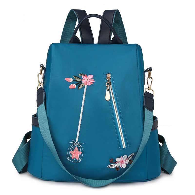 Mochila antirrobo de gran capacidad para mujer con bordado de flores de nuevo estilo Mochila de viaje de ocio de nailon antiagua de moda al por mayor