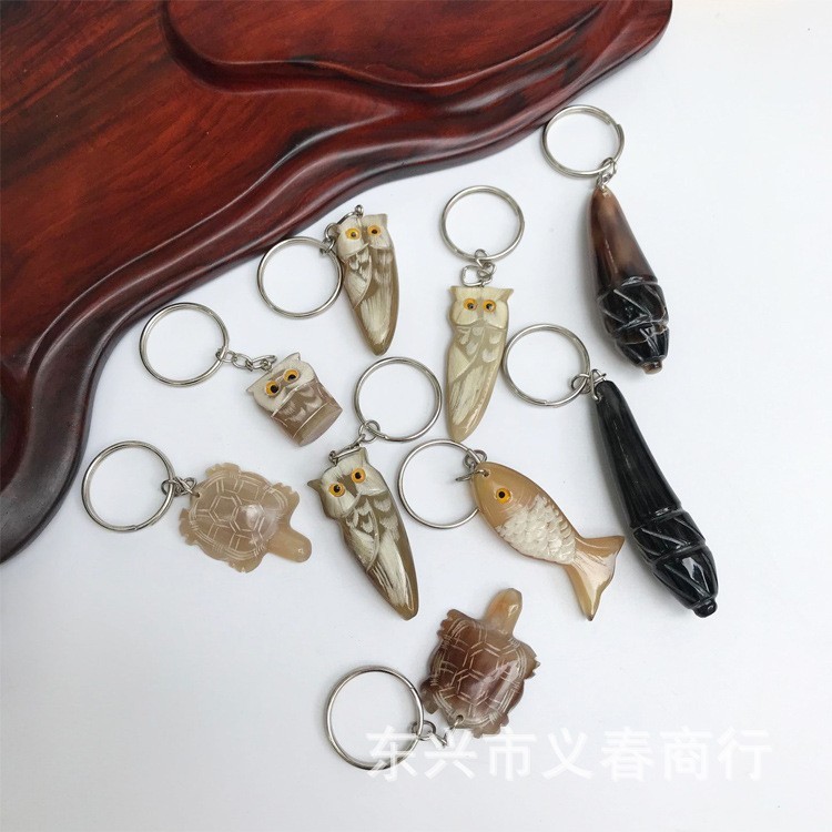 牛の角の丈夫で丈夫なキーホルダー車のロックは生肖の小動物の牛の角の製品の工芸品の車のアクセサリーを掛けます。|undefined
