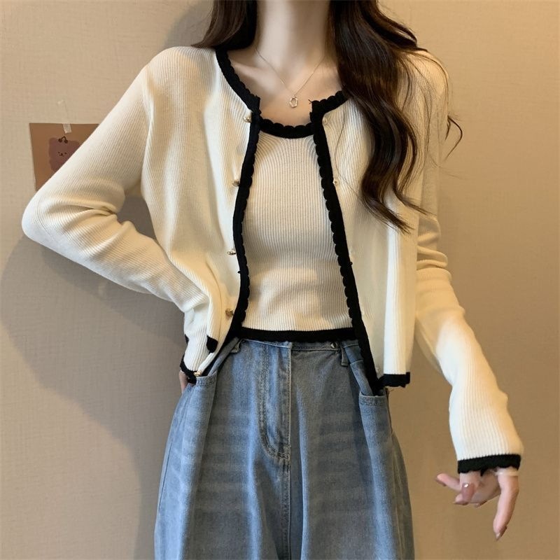 春の新型フランスの淑女の気質は色のメリヤスのカーディガンの女性にぶつかります。|undefined
