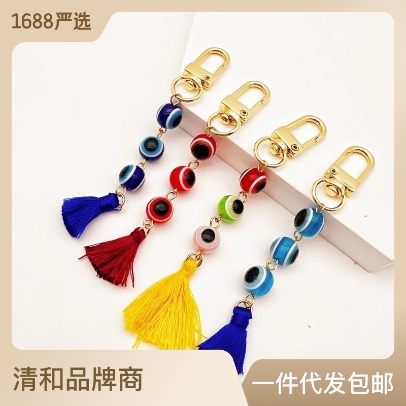 Joyería transfronteriza europea y americana pavo ojo del diablo llavero coche borla joyería chapada en oro colgante lote