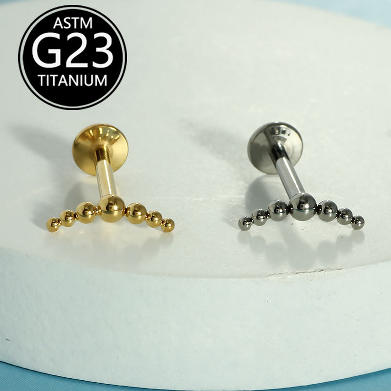 Silver pointed spike labret stud material detail