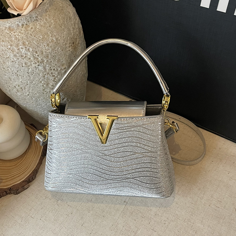 Bolsa de alta calidad de textura 2025 verano nuevo estilo bolso de hombro con patrón de ondas bolso de mensajero con patrón de serpiente de lentejuelas mujer