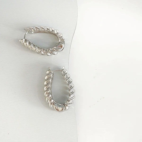 Textured ear buckles silver