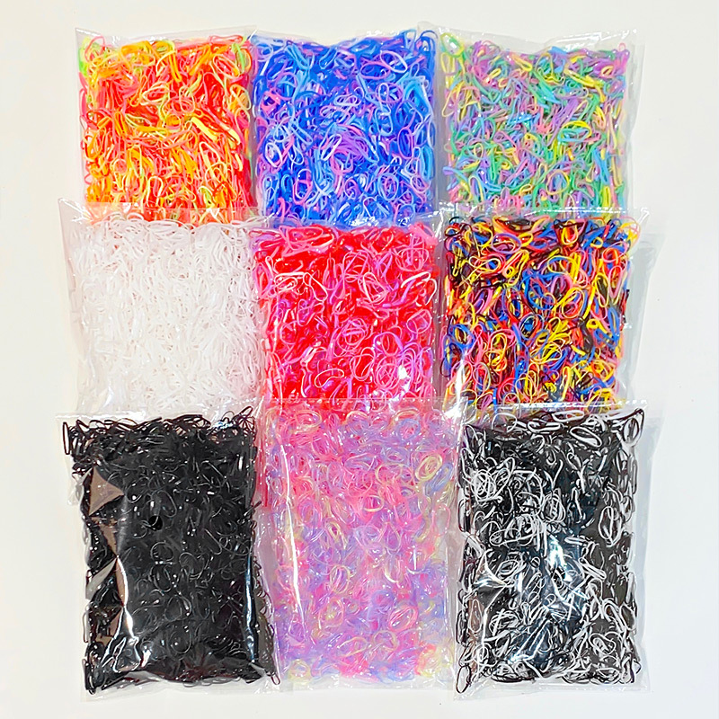 Ventas directas de fábrica para niños 1000 piezas desechables en bolsas pequeña banda de goma banda de pelo al por mayor lazo de Pelo elástico cuerda de pelo accesorios para el cabello