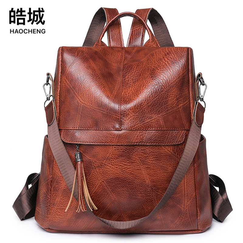 Venta al por mayor transfronteriza 2024 Nueva borla mochila antirrobo de las mujeres moda retro viaje al aire libre mochila de doble uso moda