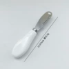White ceramic handle holed butter knife