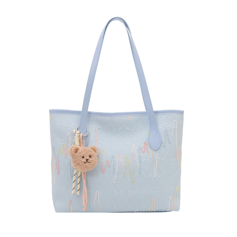 Este año, la popular bolsa de mujer de gran capacidad 2025, un nuevo colgante simplista y lindo, textura de la mochila de viaje al trabajo.