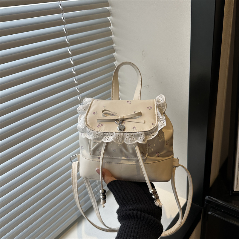 Mochila de flores para mujeres 2026 nueva moda alta sensación de mochila de estilo universitario ultra caliente de moda versátil mochila de viaje