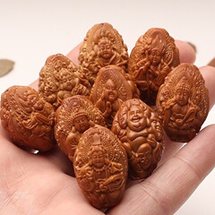 手彫りの古い材料は天上の人のオリーブの核の手串の羅漢は万仏文を拝みます。