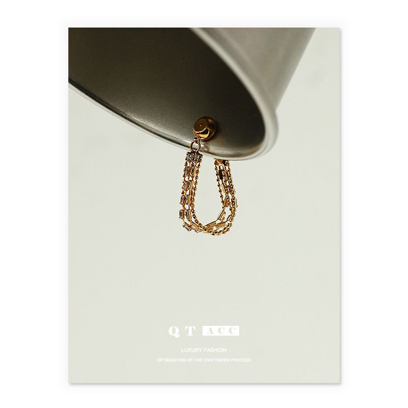 Latón chapado 18K oro real diseño temperamento earless pendientes al por mayor vintage ZIRCON borla oído clip de hueso para las mujeres