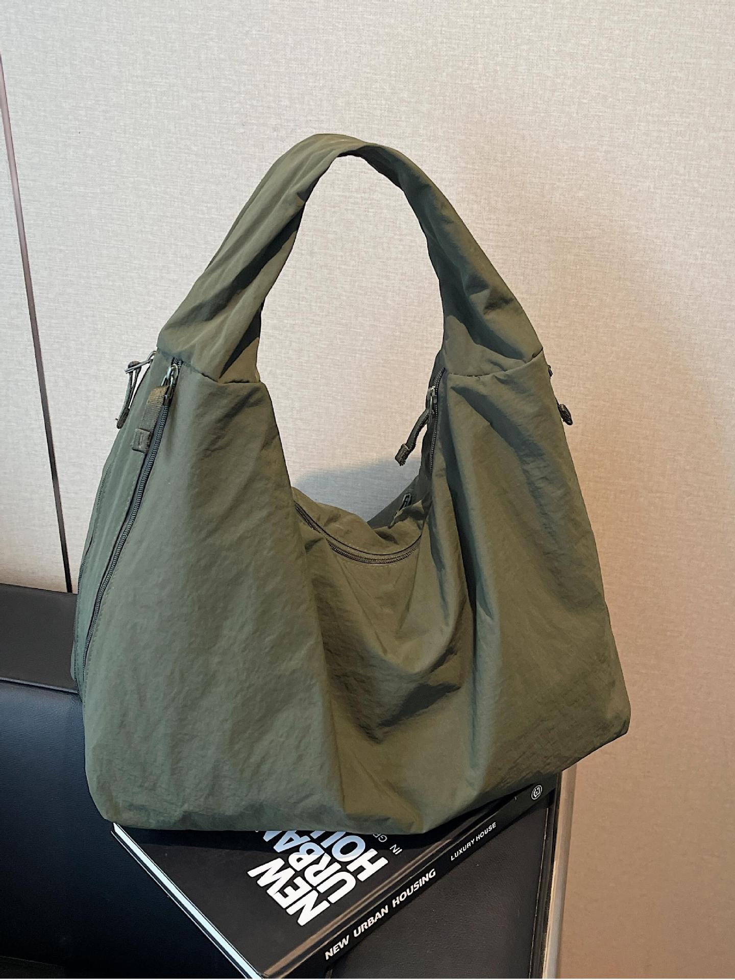 Bolso de axila de estilo explosivo de comercio exterior para mujer de gran capacidad 2025 nuevo bolso de hombro casual de tela de nailon bolso de moda simple