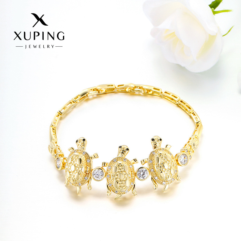 Xuping aleación de cobre chapado 14k comercio exterior transfronterizo de Europa y Estados Unidos incrustado con zircon tres nichos de tortuga pulseras de lujo ligeras