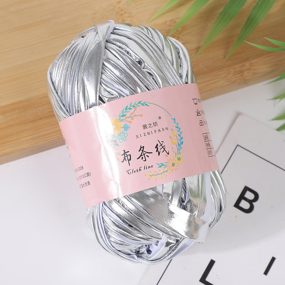 Línea textil Qian Zhi hilo de color mágico tejido a mano hilo de fantasía de color bricolaje en stock fábrica al por mayor