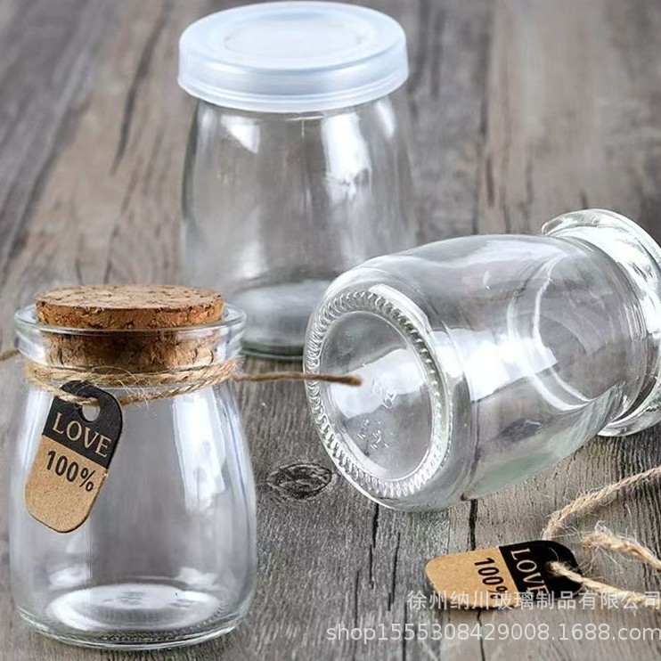 Botella de pudín de vidrio al por mayor de 100ml botella de leche gruesa botella de yogur resistente a altas temperaturas botella de vidrio tapón de madera botella de deseo botella