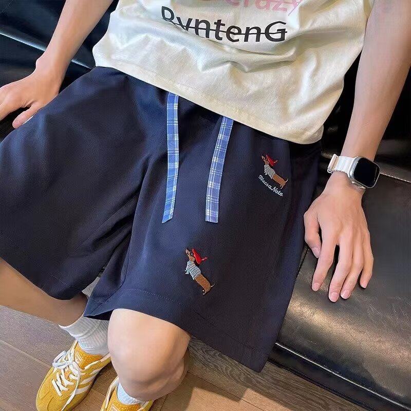 Pantalones casuales bordados de verano tendencia masculina sueltos más grandes pantalones de estilo de salchicha para hombres