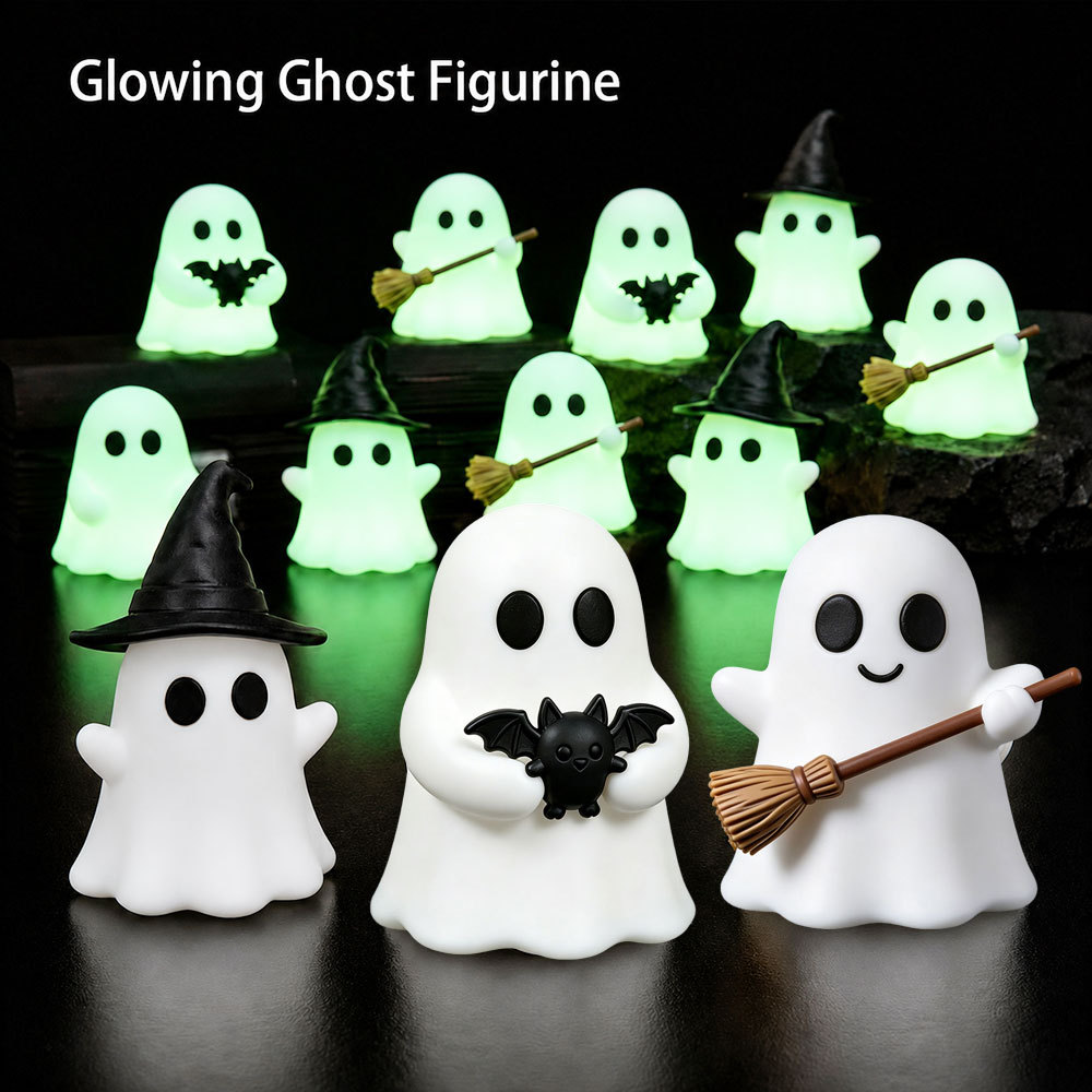 Halloween-themed desktop decoration setup with cute little ghost ornaments and mini glowing micro-landscape