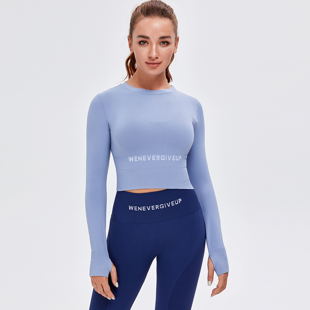 Otoño e invierno europeo y americano Nueva Impresión de letras ropa de yoga sin costuras Top deportivo de manga larga ropa de fitness desnuda ajustada para mujer