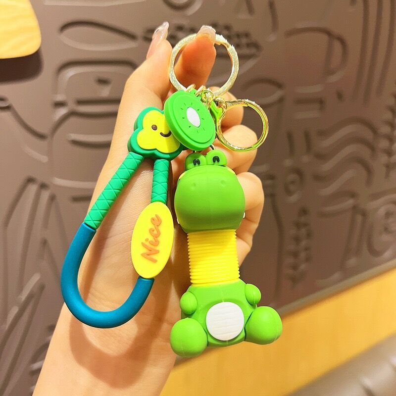 Llavero de cuello telescópico creativo de dibujos animados Divertido colgante de bolsa de descompresión colgante de coche cadena anillo pequeño regalo al por mayor