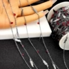Cross chain feather red diamond chain
