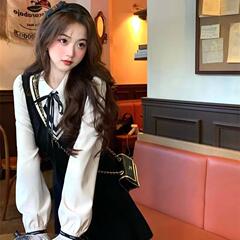 甘い偽の2つのワンピースの女性春秋の新型の韓国版の学院の風のpoloの襟の長袖の蝶結びのa字のスカートのa