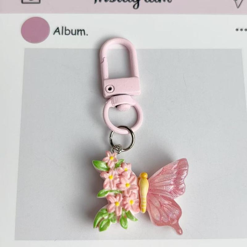 かわいい花の蝶のキーホルダーの学生の美しいカバンのペンダントの車のキーチェーンの高い顔の値の小さい大衆は飾りを掛けます。|undefined