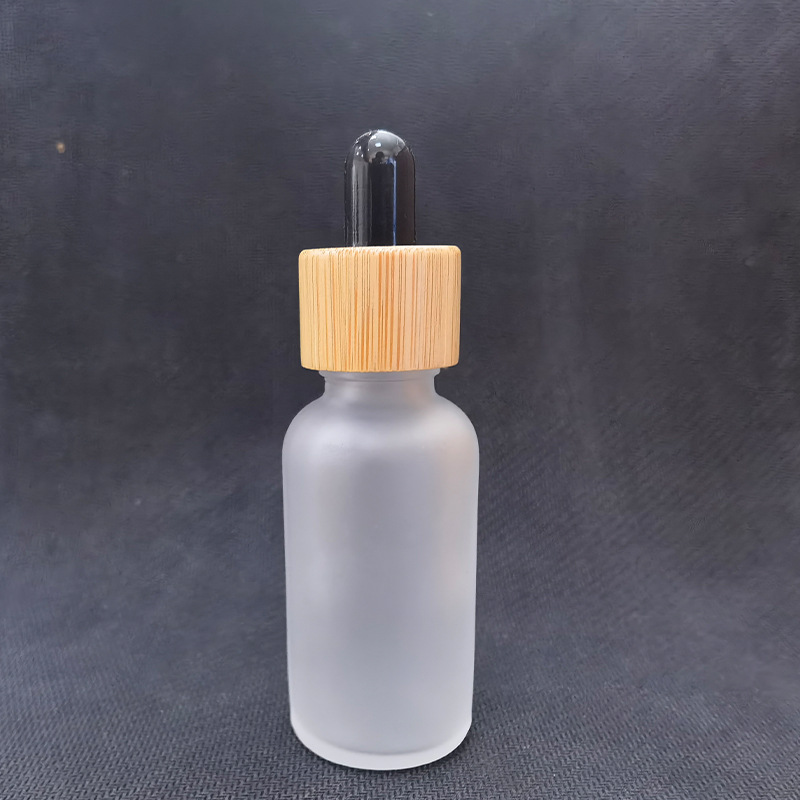 Cubierta de madera de bambú botella cosmética botella sub-botella esencia botella cuidado de la piel Paquete de envases de vidrio esmerilado botella cuentagotas botella de aceite esencial