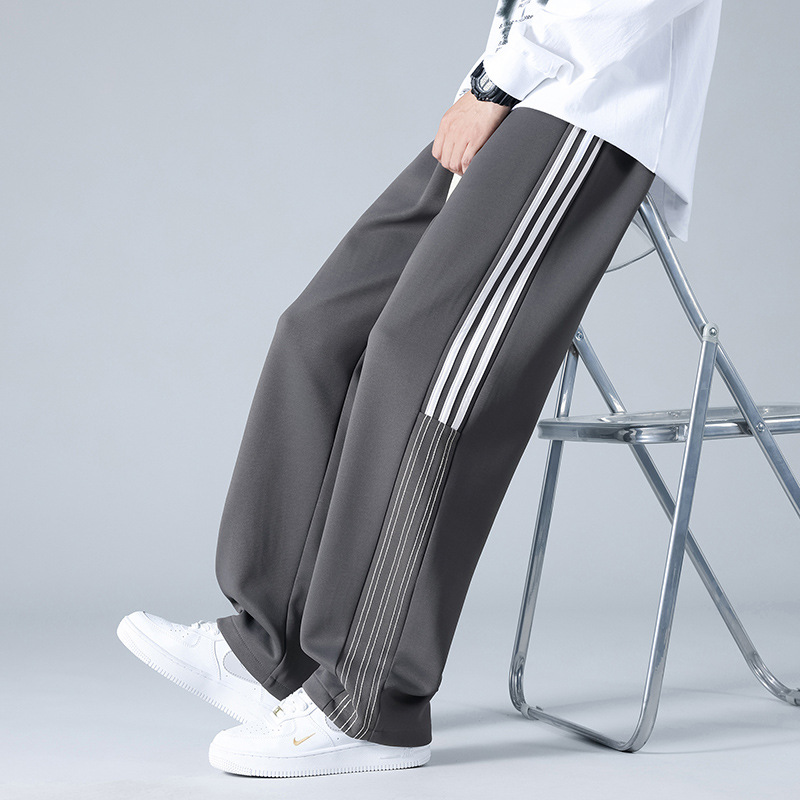 Pantalones deportivos a rayas estadounidenses para hombres y mujeres 2024 pantalones casuales rectos de cintura alta cuerdas sueltas pantalones al por mayor