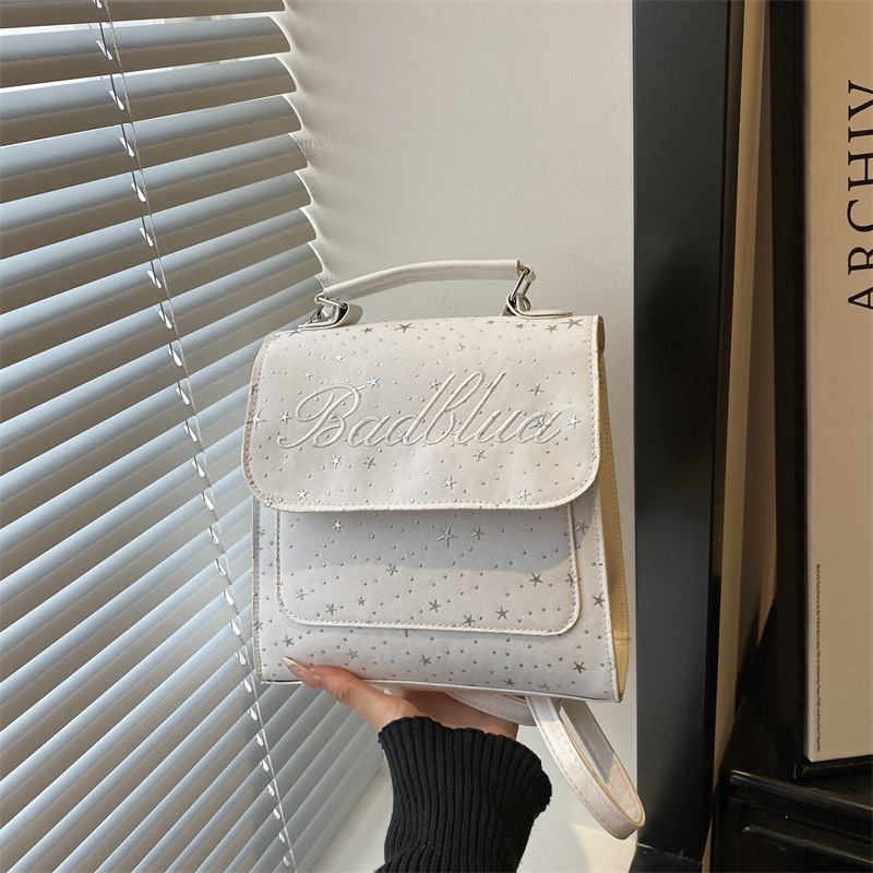 Mochila de moda coreana 2026 nuevo estilo coreano estilo académico letras versátiles bolso de hombro de mano