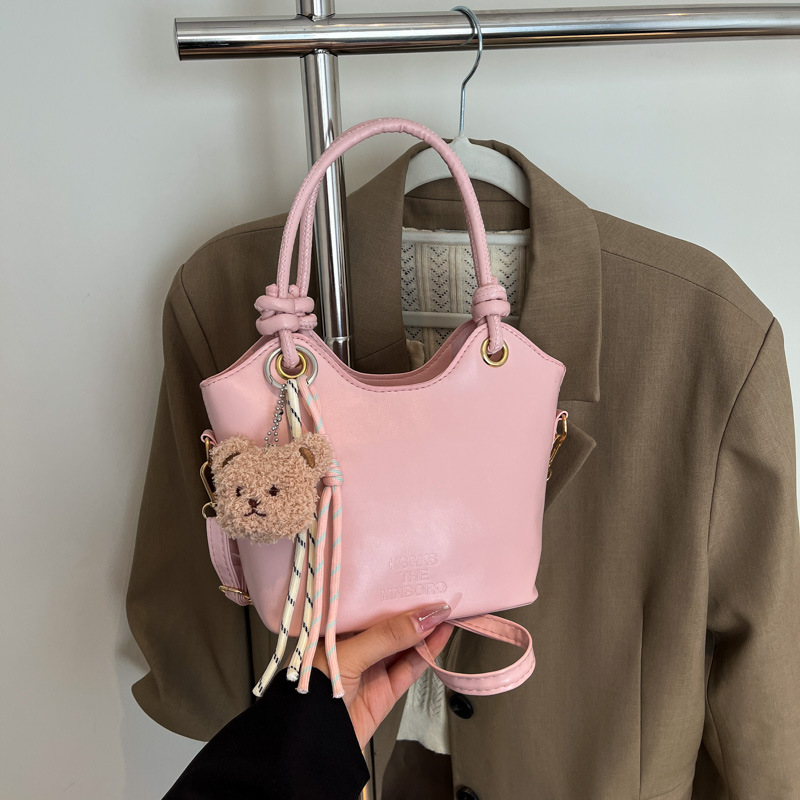 2025 nuevo bolso pequeño de estilo occidental simple y popular bolso de mensajero de moda de verano femenino bolso de cubo portátil casual